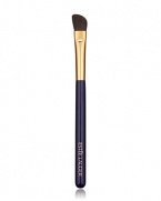 Angled brush sweeps on powder eyeshadow for allover base application plus definition on the outer lid and crease.