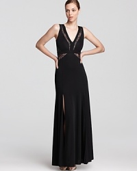 Sheer lace details lend allure to a sophisticated BCBGMAXAZRIA gown.