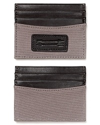 Avoid the bulky wallet syndrome with this compact card holder, featuring handsome leather trim details and a double arrow logo.