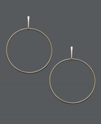 Vintage hoops with a light and airy look. These chic, skinny loops feature a post design in 14k gold. Approximate drop: 2 inches.