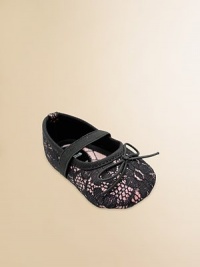 A pretty lace overlay with tiny bows and elastic straps across the instep.Polyurethane shoeRound toeElastic instep strapMicrofiber liningSoft polyurethane soleImportedAdditional InformationKid's Shoe Size Guide (European Equivalent) 