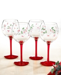 Etched and hand painted with a festive pattern of holly and berries, these red-stemmed Winterberry wine glasses from Pfaltzgraff make a merry impression at your holiday table.