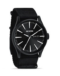 Sold and streamlined, this matte black watch from Nixon is a perfect fusion of performance and design. Designed for durable style, it flaunts a nylon strap, advanced movement and date and day feature.