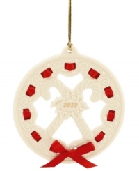 All wrapped up in a holiday bow, this graceful wreath ornament makes a memorable gift for 2012. With carved candy canes, holly and pretty scrolling detail in Lenox porcelain.