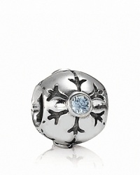 A delicately etched snowflake with a sparkling aqua zirconia center adorns this sterling silver charm by PANDORA.