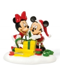 Taking style cues from Santa Claus, Mickey and Minnie sport holiday red as they put the finishing touches on a perfectly wrapped present. A great gift itself, this collectible figurine is cute for kids' rooms.