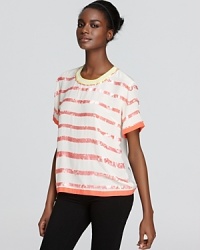 Light things up in a sequin stripe Madison Marcus top alive with color and touting sheer texture. A neon trim at the neckline lends a flash of fashion-forward appeal and a back keyhole opening finishes with a playful touch.