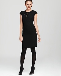 A careerist essential gets a contemporary update as delicately beaded trim accentuates the classic silhouette of this Tory Burch sheath dress. An alluring keyhole and intricate pleating at the neckline ensure that all eyes are on you.