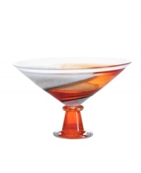 A unique piece that enhances a table or mantelpiece and serves as a majestic display for assorted fruit, this handcrafted bowl from one of the leading glass houses is graced with radiant hues of rust and orange ascending from base to mouth. 7 1/2 tall. Imported.