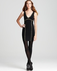 Shimmer and shine with a little help from this little black GUESS dress. The metallic panels and flattering bondage fit make it a party show-stopper.