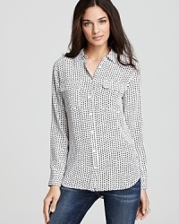 An edgy star print adorns this luxe silk Equipment blouse. Partner the look with distressed jeans for downtown cool.