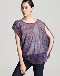 This sheer paisley printed Sweet Pea top lends an edgy asymmetrical shape and ethereal layer over a classic cami.