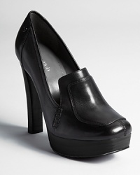 A loafer silhouette is equipped with a rich mahogany sole and dressed up with stitched details. From Calvin Klein.