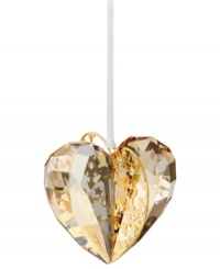 Goldtone metal pierced with intricate patterns and sparkling chatons adds even more splendor to this exquisite Swarovski crystal heart ornament.