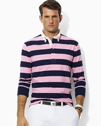 Bold, preppy stripes lend a heritage appeal to a relaxed-fitting polo shirt, crafted from lightweight cotton mesh for a breathable wear.